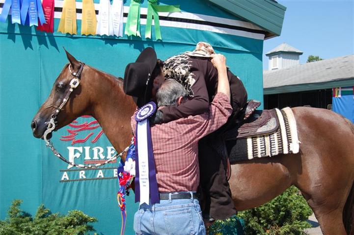Kat and Grandfather embrace in memory of Khemosha Bey //, as Kat and Sierra Defended his titles in Western Horsemanship and Equitation